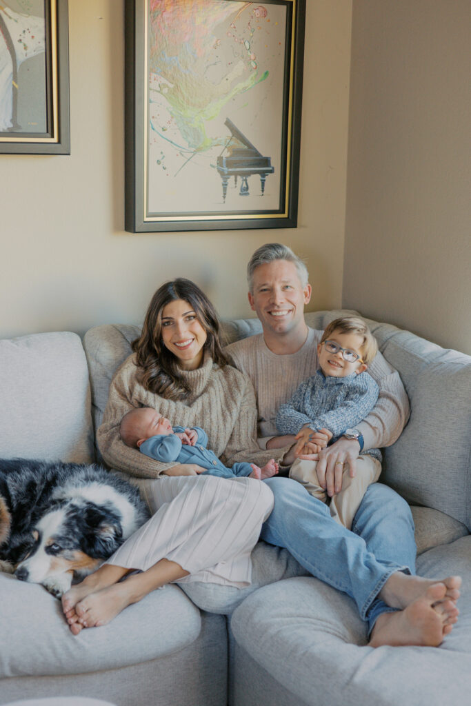 In-home newborn photography session in Alameda with an East Bay family welcoming their second child, photo taken with dog