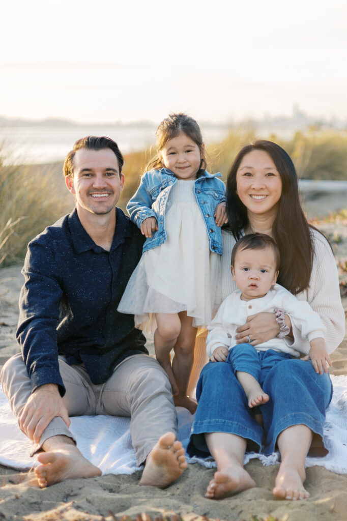 family poses during east bay family photography session on alameda beach