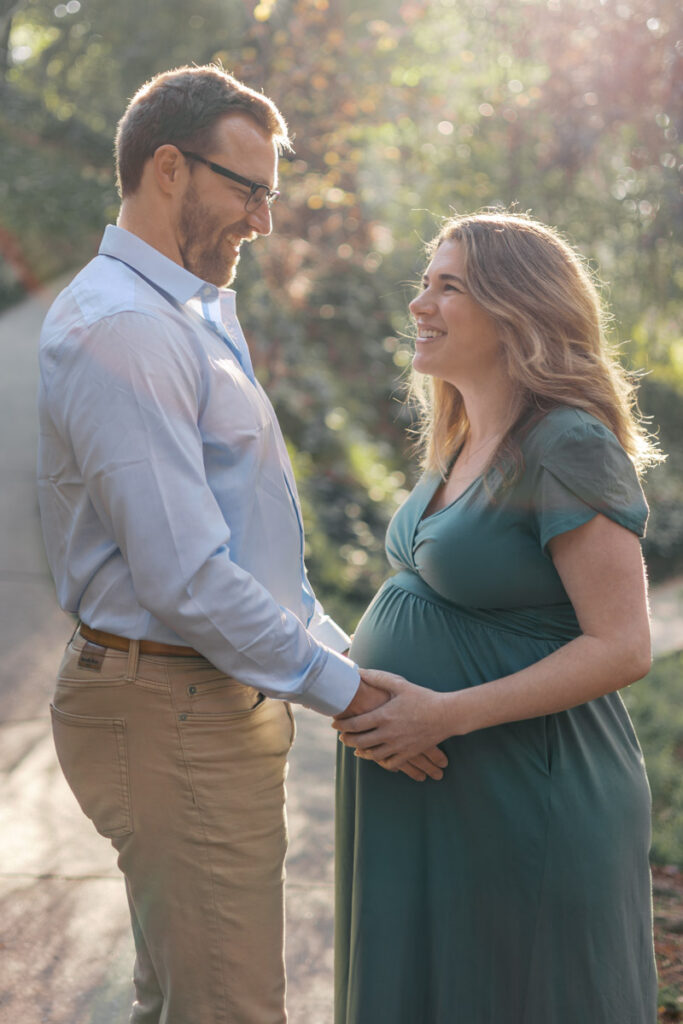 piedmont park couple poses for a maternity photography session