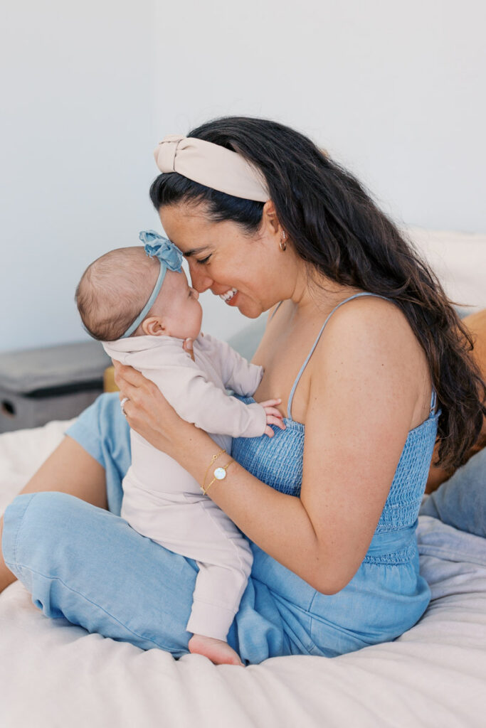 mom and 2 month old cuddling during newborn photography session