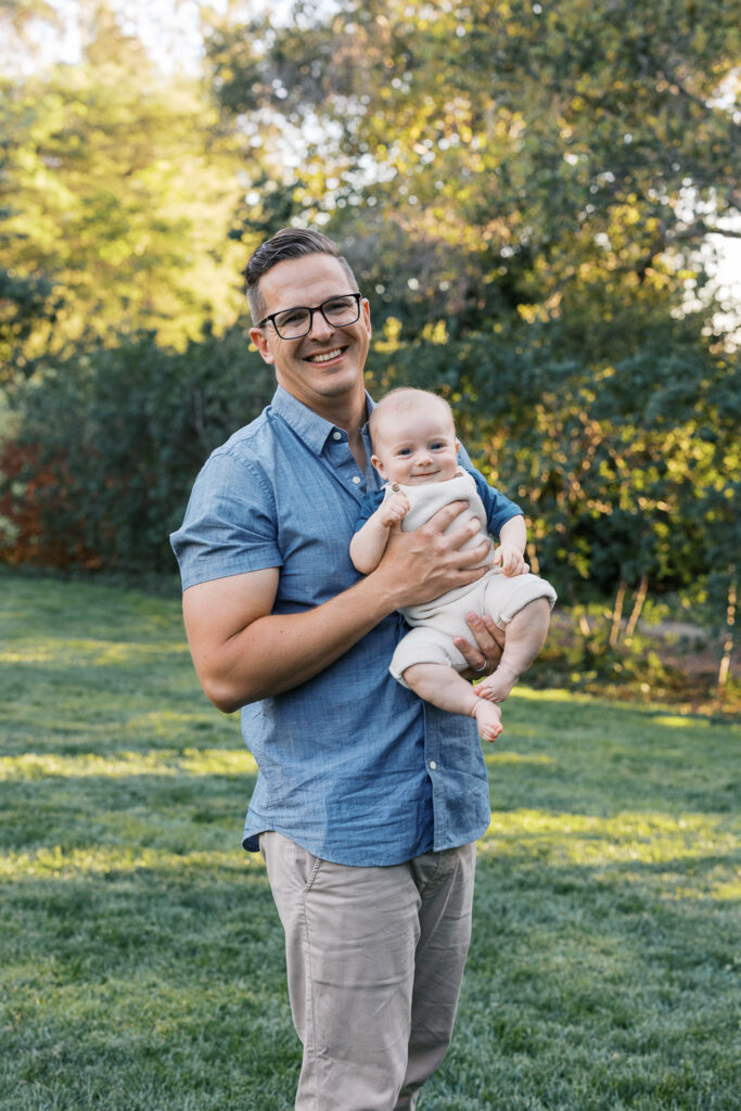 Dad holds baby at Dracena Park in Piedmont
