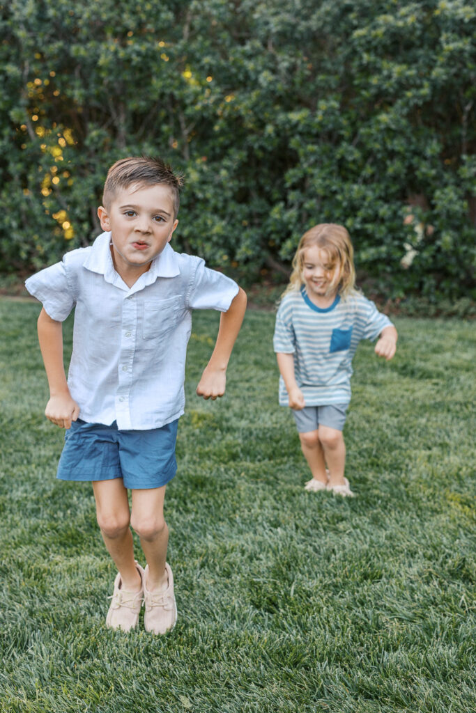 two young boys jump around and play at Dracena Park