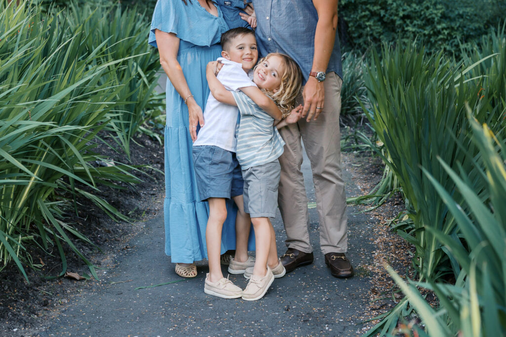 two young brothers smile and hug during a piedmont family photography session at dracena park