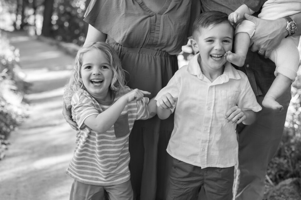 two young boys at Dracena Park in piedmont, laughing and poking each other during a Piedmont family photo session