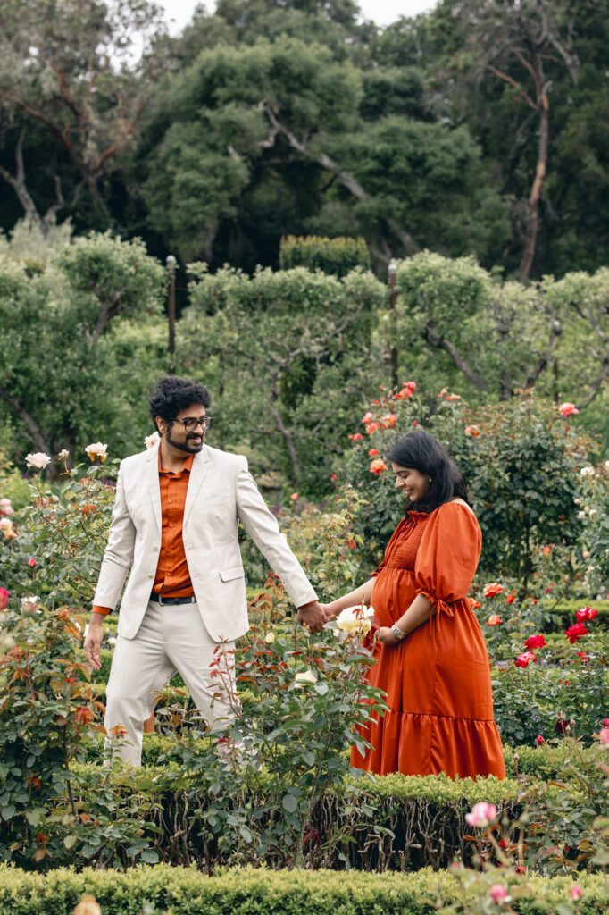 Bay Area maternity session - expecting couple walk thru the rose garden at Filoli in Woodside, CA in spring