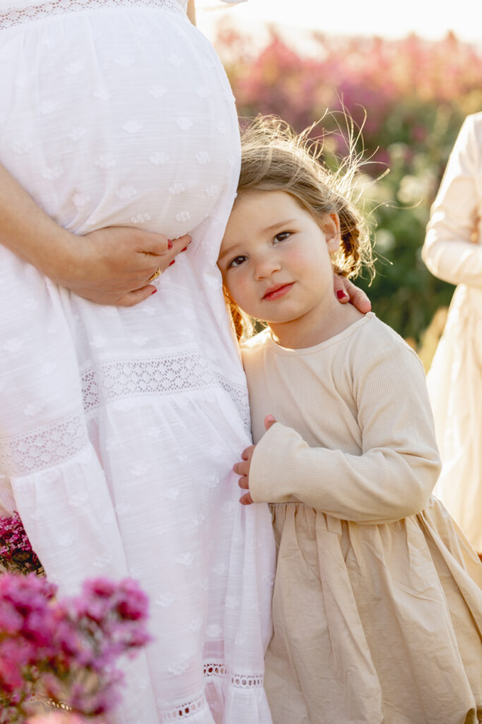 Young toddler with expecting mother during a Bay Area maternity photography session in East Bay