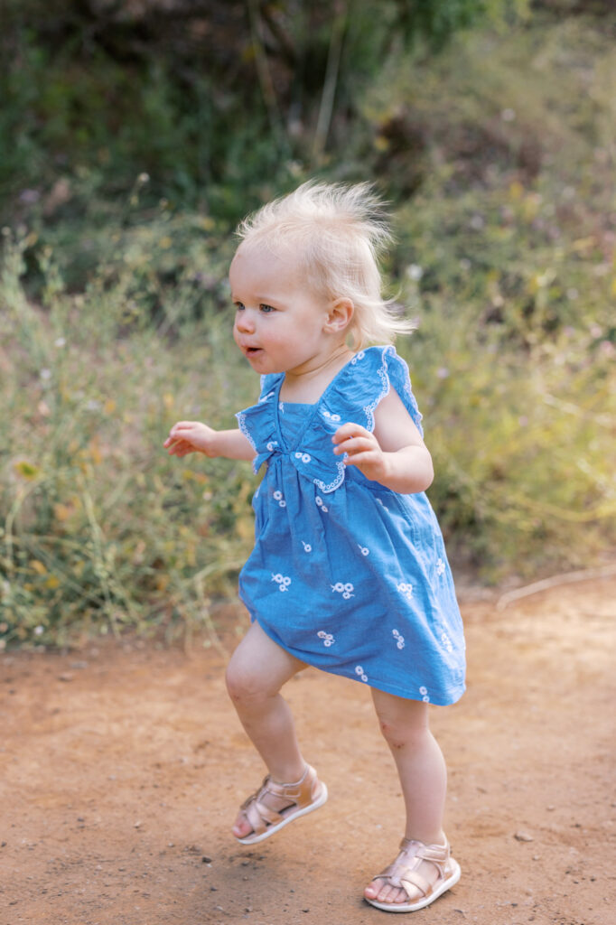 New runner toddles down a trail in San Francisco at Golden Gate Park