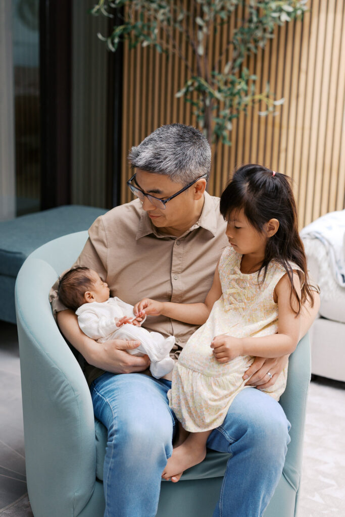 Father and two small children during San Mateo newborn session in their home